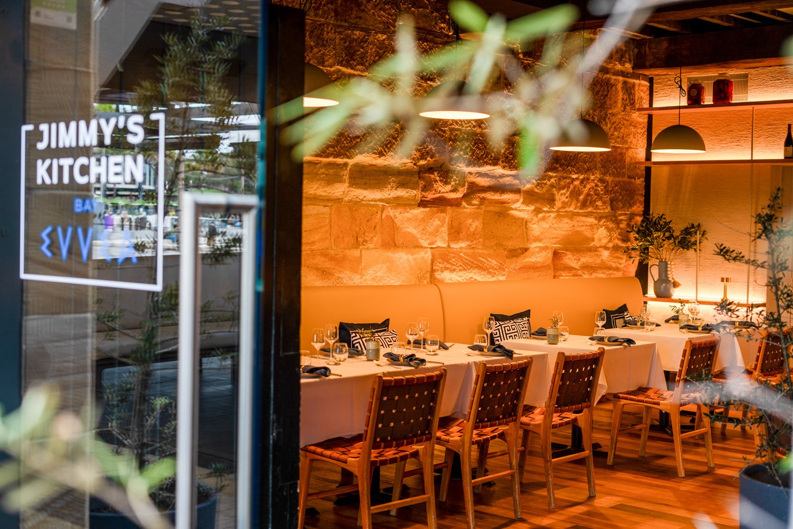 Jimmy's Kitchen Bay Nine dining room with sandstone walls and set tables