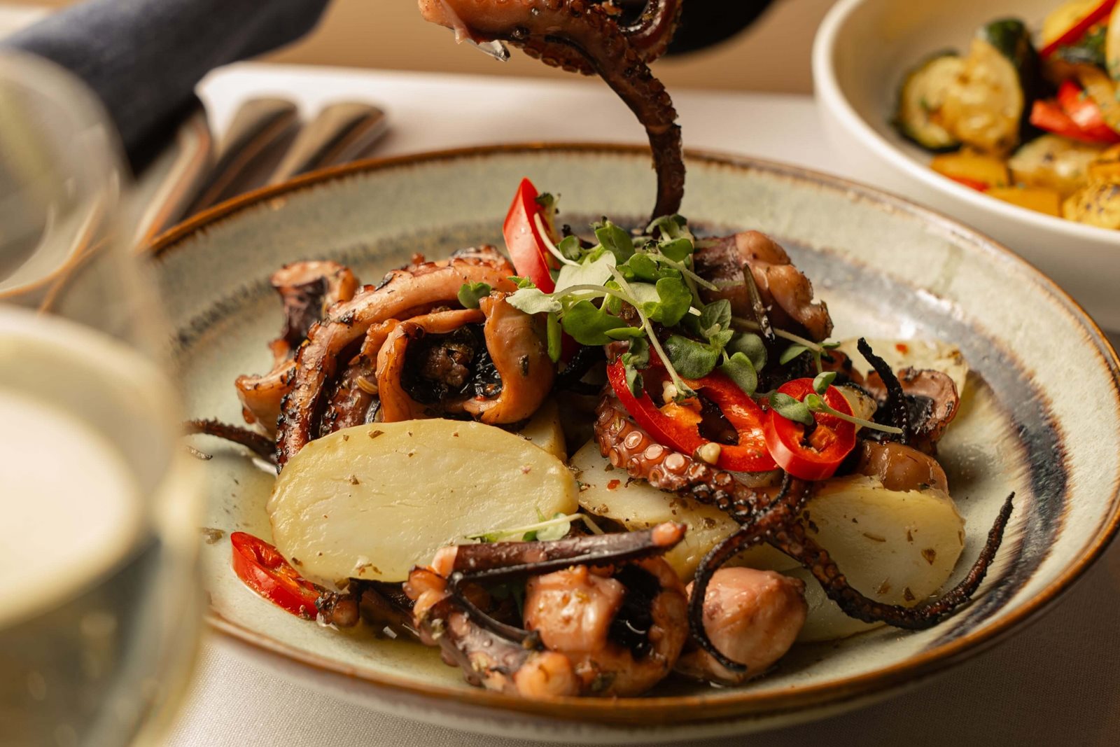 Grilled octopus with potato, chilli, and greens at Jimmy's Kitchen Bay Nine
